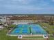 Well-maintained tennis and pickleball courts with seating areas at 552 Box Elder Ct, Englewood, FL 34223