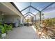 Outdoor kitchen and seating area in this screened lanai at 552 Box Elder Ct, Englewood, FL 34223