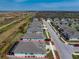 Aerial view showcasing home's backyard and community at 552 Box Elder Ct, Englewood, FL 34223