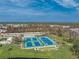 Aerial view of community pickleball and tennis courts at 552 Box Elder Ct, Englewood, FL 34223