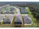 Aerial view of a home with a screened lanai at 552 Box Elder Ct, Englewood, FL 34223