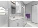 Elegant bathroom with double vanity, large mirrors, and a walk-in shower at 14344 Amestoy Ave, Port Charlotte, FL 33981