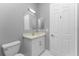 Clean bathroom with white vanity and grey walls at 14344 Amestoy Ave, Port Charlotte, FL 33981