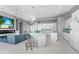 Modern kitchen with white cabinets and a large island at 14344 Amestoy Ave, Port Charlotte, FL 33981