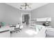 Bright home office with white furniture and built-in shelving at 14344 Amestoy Ave, Port Charlotte, FL 33981