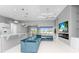 Open living area with sectional sofa, fireplace, and view of pool at 14344 Amestoy Ave, Port Charlotte, FL 33981