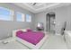 Main bedroom with king-size bed and ensuite bathroom access at 14344 Amestoy Ave, Port Charlotte, FL 33981