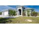 Modern home with three-car garage and landscaped yard at 14344 Amestoy Ave, Port Charlotte, FL 33981