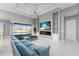 Open living area with sectional sofa, fireplace, and view of pool at 14344 Amestoy Ave, Port Charlotte, FL 33981