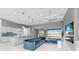 Modern kitchen with white cabinets, a large island, and blue tile backsplash at 14344 Amestoy Ave, Port Charlotte, FL 33981