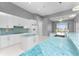 Modern kitchen with white cabinets and stunning blue granite countertops at 14344 Amestoy Ave, Port Charlotte, FL 33981