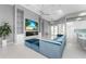 Open living area with sectional sofa, fireplace, and view of pool at 14344 Amestoy Ave, Port Charlotte, FL 33981