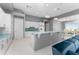 Modern kitchen with white cabinets, island, and breakfast bar at 14344 Amestoy Ave, Port Charlotte, FL 33981