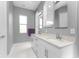 Double vanity bathroom with gray walls and white cabinets at 14344 Amestoy Ave, Port Charlotte, FL 33981