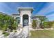 House exterior with stone accents and palm trees at 14344 Amestoy Ave, Port Charlotte, FL 33981