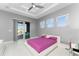 Main bedroom with king bed, access to patio, and large windows at 14344 Amestoy Ave, Port Charlotte, FL 33981