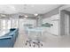 Modern kitchen with white cabinets and a large island at 14344 Amestoy Ave, Port Charlotte, FL 33981