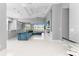 Open living area with sectional sofa, fireplace, and view of pool at 14344 Amestoy Ave, Port Charlotte, FL 33981