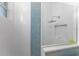 Modern shower with glass enclosure and blue mosaic tile accents at 14344 Amestoy Ave, Port Charlotte, FL 33981