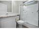 Clean bathroom with a shower/tub combo and white vanity at 9085 Pinehaven Way, Englewood, FL 34224