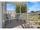 Relaxing screened porch with seating for enjoying the outdoors at 9085 Pinehaven Way, Englewood, FL 34224