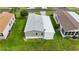 Aerial view of mobile home with additional structure at 9085 Pinehaven Way, Englewood, FL 34224
