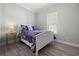 Cozy bedroom with a double bed and light flooring at 9085 Pinehaven Way, Englewood, FL 34224