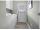 Convenient laundry room with washer, dryer, and exterior access at 9085 Pinehaven Way, Englewood, FL 34224