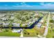 Aerial view of waterfront home with canal access and lush landscaping at 4199 Hollis Ave, Port Charlotte, FL 33953