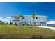 Two-story house with a large yard and driveway at 4199 Hollis Ave, Port Charlotte, FL 33953