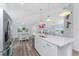 Modern kitchen with white cabinets, island and stainless steel appliances at 4199 Hollis Ave, Port Charlotte, FL 33953