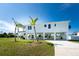 Two-story modern home with white exterior and large windows at 4199 Hollis Ave, Port Charlotte, FL 33953
