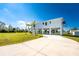 Two-story waterfront home with open floor plan, and large driveway at 4199 Hollis Ave, Port Charlotte, FL 33953