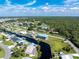 An aerial view of a house and neighborhood by the water at 4199 Hollis Ave, Port Charlotte, FL 33953