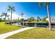 Peaceful waterfront view with lush landscaping and canal access at 4199 Hollis Ave, Port Charlotte, FL 33953