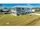 Elevated home on stilts with a large yard and canal views at 4199 Hollis Ave, Port Charlotte, FL 33953