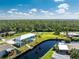 An aerial view of a waterfront home with canal access and a private dock at 4199 Hollis Ave, Port Charlotte, FL 33953