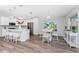 Spacious kitchen with island seating, hardwood floors, and view to dining area at 4199 Hollis Ave, Port Charlotte, FL 33953