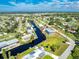 Aerial view of a waterfront home with a large yard at 4199 Hollis Ave, Port Charlotte, FL 33953