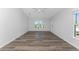 Spacious bedroom with large windows and vinyl flooring at 4199 Hollis Ave, Port Charlotte, FL 33953