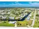 Aerial view showcasing a home's waterfront location and neighborhood at 4199 Hollis Ave, Port Charlotte, FL 33953