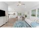 Open concept living room, kitchen, and dining area with modern finishes at 4199 Hollis Ave, Port Charlotte, FL 33953