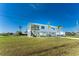 Two-story house with a large yard and driveway at 4199 Hollis Ave, Port Charlotte, FL 33953