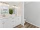 Double vanity bathroom with walk-in shower and vinyl flooring at 4199 Hollis Ave, Port Charlotte, FL 33953