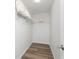 Walk-in closet with wire shelving and vinyl flooring at 4199 Hollis Ave, Port Charlotte, FL 33953