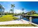 Private dock and walkway leading to a serene canal at 4199 Hollis Ave, Port Charlotte, FL 33953