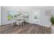 Bright dining area with wood-look flooring and access to a patio at 4199 Hollis Ave, Port Charlotte, FL 33953