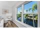 Stunning canal view from a bright living room with large windows at 4199 Hollis Ave, Port Charlotte, FL 33953