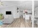 Open concept kitchen features white cabinets and island at 4199 Hollis Ave, Port Charlotte, FL 33953