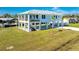 Two-story waterfront home with a metal roof and large deck at 4199 Hollis Ave, Port Charlotte, FL 33953